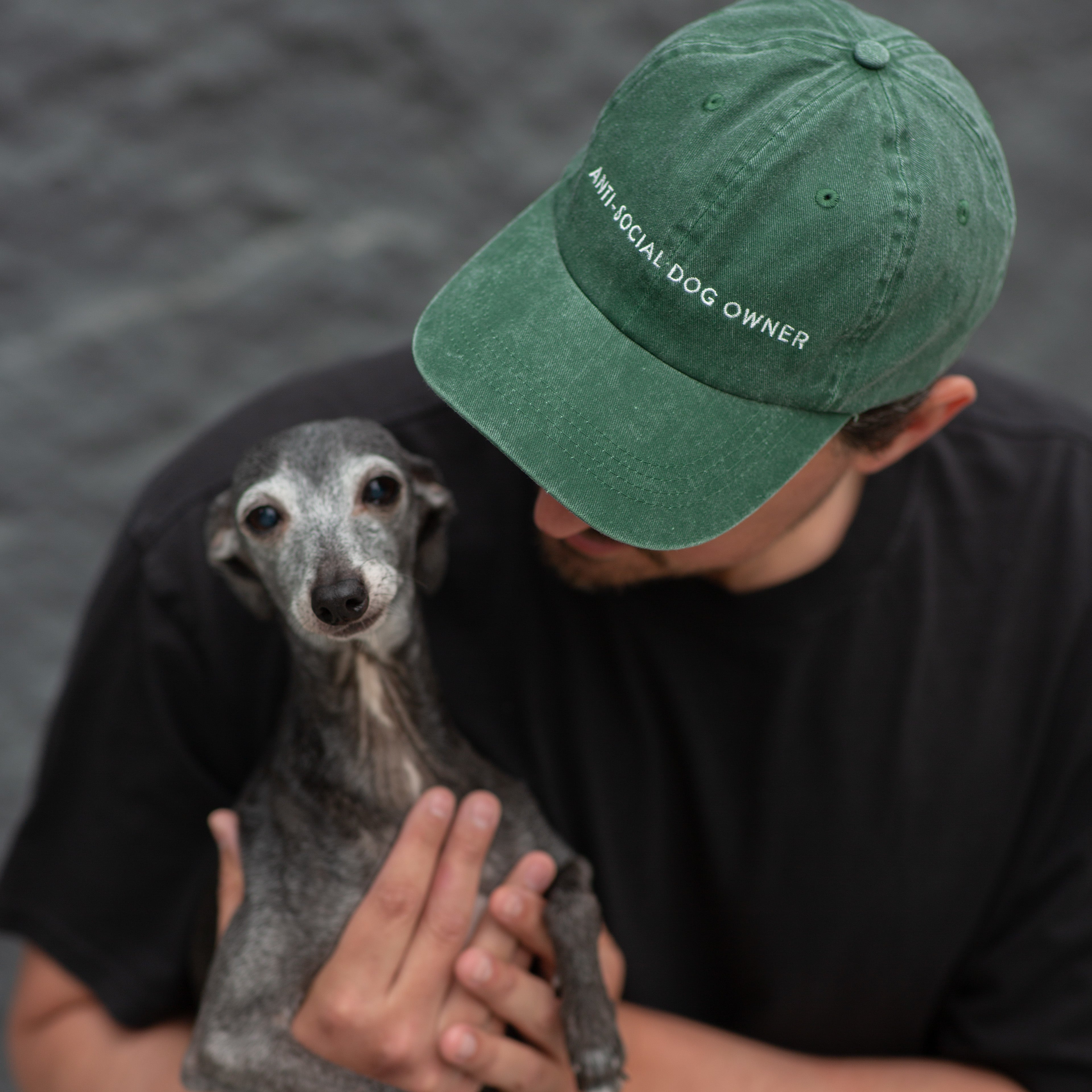 green-denim-cap-anti-social-dog-owner-wearing-man.jpg